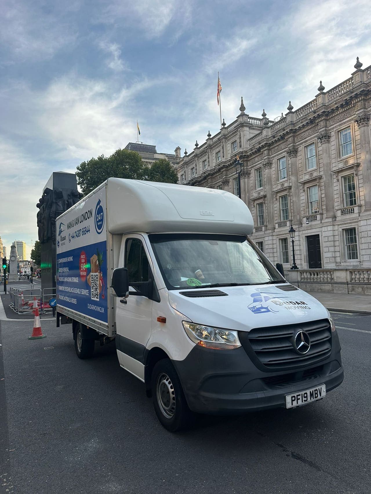 A Dudar Moving Luton van parked on a London street